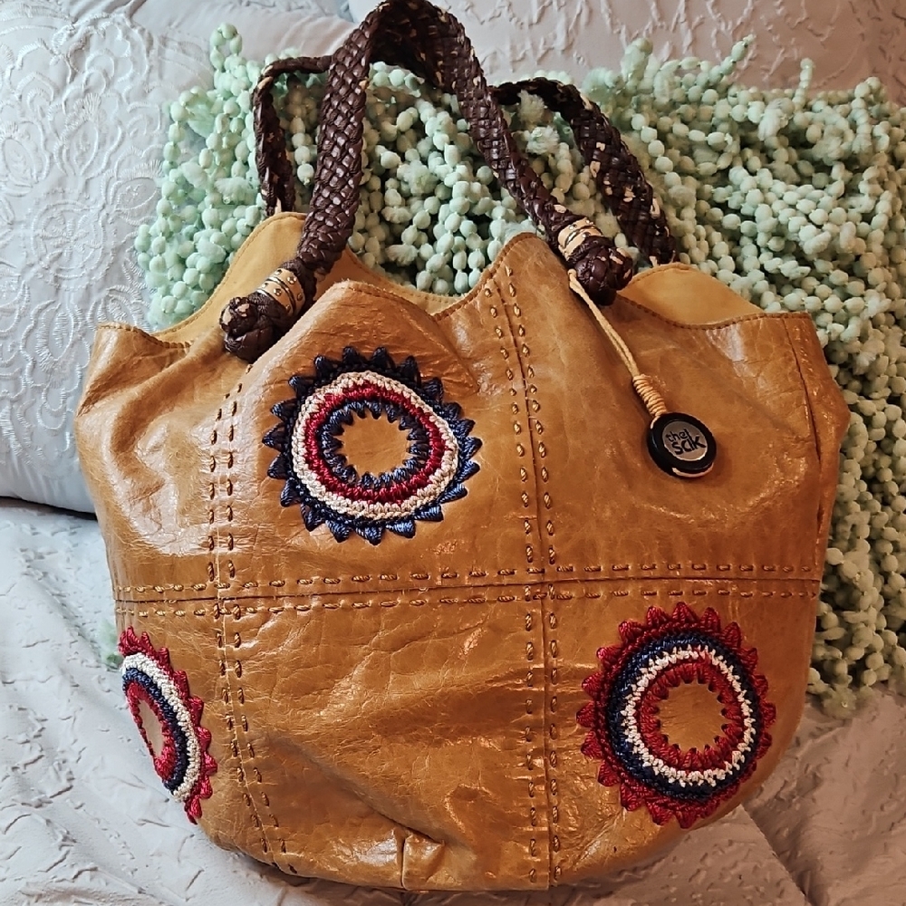 The Sak Tan and Red Hobo Bag with Artistic Embellishments